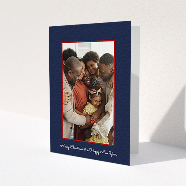A personalised christmas card called 'Blue and Red'. It is an A6 card in a portrait orientation. It is a photographic personalised christmas card with room for 1 photo. 'Blue and Red' is available as a folded card, with tones of red and blue.