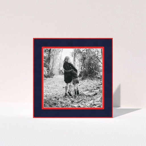 A personalised christmas card named "Bold Border". It is a square (148mm x 148mm) card in a square orientation. It is a photographic personalised christmas card with room for 1 photo. "Bold Border" is available as a folded card, with tones of red and blue.