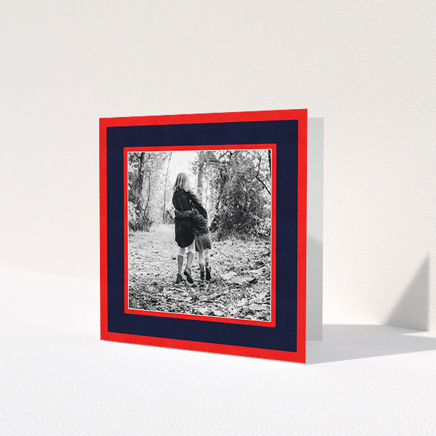 A personalised christmas card named 'Bold Border'. It is a square (148mm x 148mm) card in a square orientation. It is a photographic personalised christmas card with room for 1 photo. 'Bold Border' is available as a folded card, with tones of red and blue.