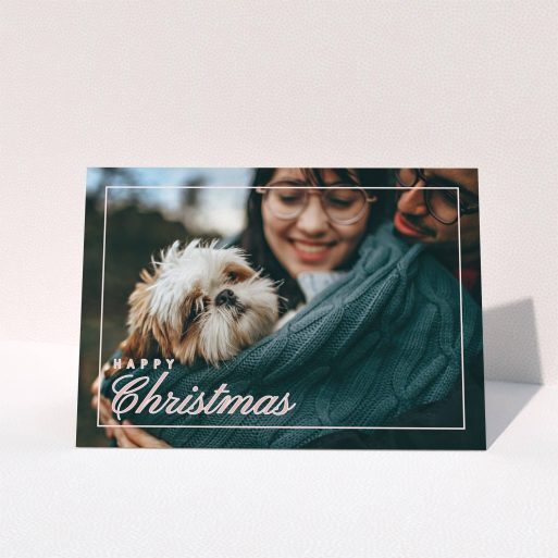A personalised christmas card named "Border Overlay". It is an A6 card in a landscape orientation. It is a photographic personalised christmas card with room for 1 photo. "Border Overlay" is available as a folded card, with mainly light pink colouring.