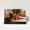 A personalised christmas card named "Bottom of the Stocking". It is an A5 card in a landscape orientation. It is a photographic personalised christmas card with room for 1 photo. "Bottom of the Stocking" is available as a folded card, with tones of dark green and red.