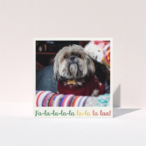 A personalised christmas card named "Choral". It is a square (148mm x 148mm) card in a square orientation. It is a photographic personalised christmas card with room for 1 photo. "Choral" is available as a folded card, with tones of light cream and red.