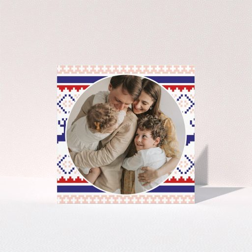 A personalised christmas card template titled "Christmas Stitch". It is a square (148mm x 148mm) card in a square orientation. It is a photographic personalised christmas card with room for 1 photo. "Christmas Stitch" is available as a folded card, with tones of pink, navy blue and red.
