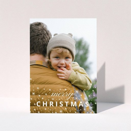 A personalised christmas card called "Falling Snow Photo". It is an A5 card in a portrait orientation. It is a photographic personalised christmas card with room for 1 photo. "Falling Snow Photo" is available as a folded card, with mainly white colouring.