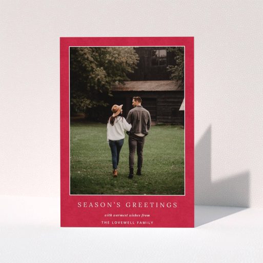 A personalised christmas card design named "Father C's Hat". It is an A5 card in a portrait orientation. It is a photographic personalised christmas card with room for 1 photo. "Father C's Hat" is available as a folded card, with tones of red and white.