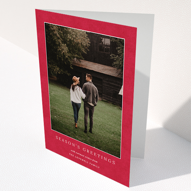 A personalised christmas card design named "Father C's Hat". It is an A5 card in a portrait orientation. It is a photographic personalised christmas card with room for 1 photo. "Father C's Hat" is available as a folded card, with tones of red and white.