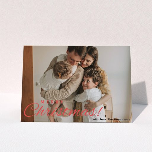 A personalised christmas card design called "Merry Christmas Photo". It is an A5 card in a landscape orientation. It is a photographic personalised christmas card with room for 1 photo. "Merry Christmas Photo" is available as a folded card, with tones of white and red.