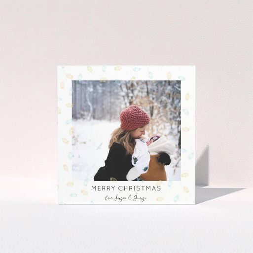 A personalised christmas card design called "Most Glovely Time of the Year". It is a square (148mm x 148mm) card in a square orientation. It is a photographic personalised christmas card with room for 1 photo. "Most Glovely Time of the Year" is available as a folded card, with tones of white, blue and light orange.