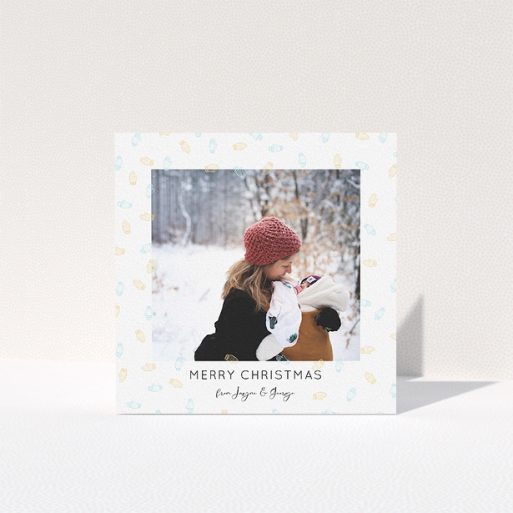A personalised christmas card design called "Most Glovely Time of the Year". It is a square (148mm x 148mm) card in a square orientation. It is a photographic personalised christmas card with room for 1 photo. "Most Glovely Time of the Year" is available as a folded card, with tones of white, blue and light orange.