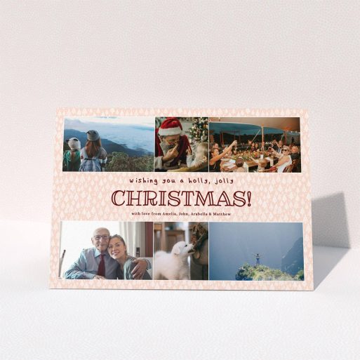 A personalised christmas card named "Pink Forrest". It is an A5 card in a landscape orientation. It is a photographic personalised christmas card with room for 6 photos. "Pink Forrest" is available as a folded card, with mainly pink colouring.