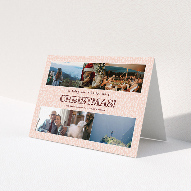 A personalised christmas card named 'Pink Forrest'. It is an A5 card in a landscape orientation. It is a photographic personalised christmas card with room for 6 photos. 'Pink Forrest' is available as a folded card, with mainly pink colouring.