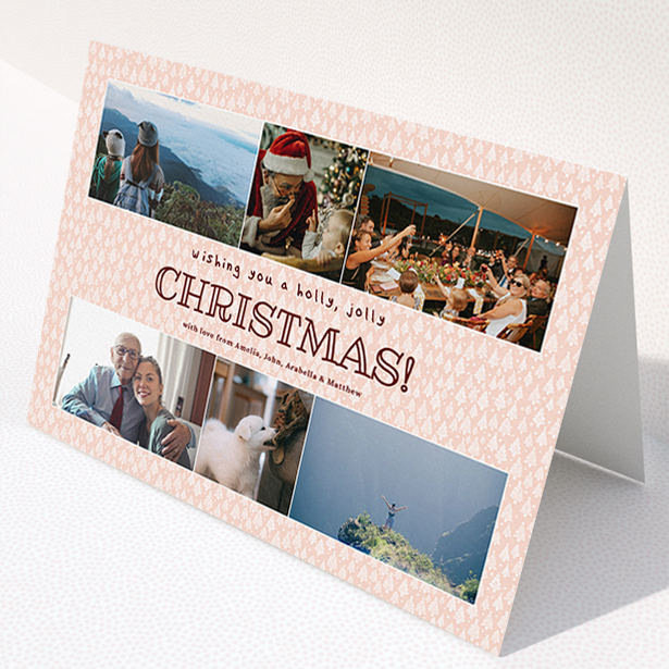 A personalised christmas card named "Pink Forrest". It is an A5 card in a landscape orientation. It is a photographic personalised christmas card with room for 6 photos. "Pink Forrest" is available as a folded card, with mainly pink colouring.