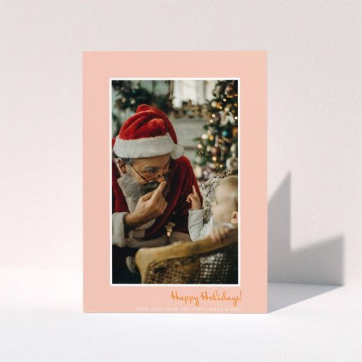 A personalised christmas card design titled "Smoked Salmon". It is an A5 card in a portrait orientation. It is a photographic personalised christmas card with room for 1 photo. "Smoked Salmon" is available as a folded card, with tones of pink and white.
