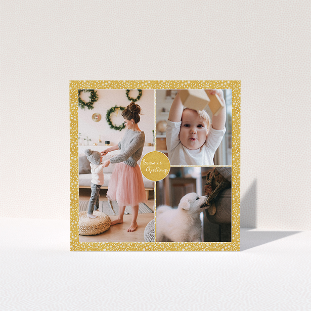 A personalised christmas card design titled "Sparkling Gold". It is a square (148mm x 148mm) card in a square orientation. It is a photographic personalised christmas card with room for 3 photos. "Sparkling Gold" is available as a folded card, with tones of gold and white.