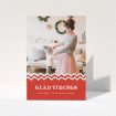 A personalised christmas card named "Tidal Tidings". It is an A5 card in a portrait orientation. It is a photographic personalised christmas card with room for 1 photo. "Tidal Tidings" is available as a folded card, with tones of red and white.