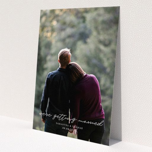 A personalised wedding invitation called 'Across the Photo'. It is an A5 invite in a portrait orientation. It is a photographic personalised wedding invitation with room for 1 photo. 'Across the Photo' is available as a flat invite, with mainly white colouring.