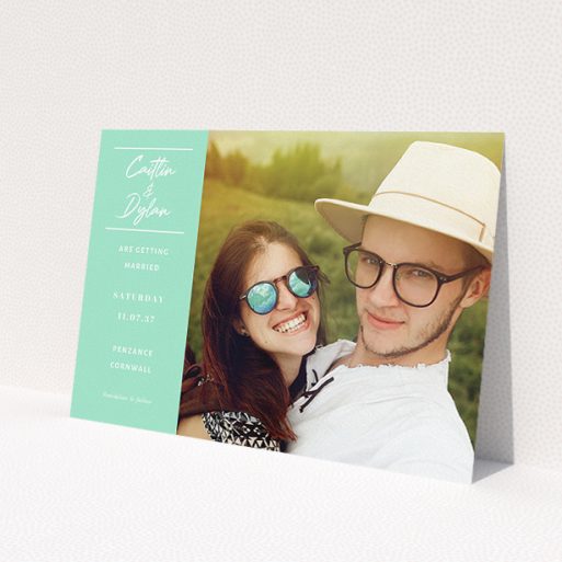 A personalised wedding invitation design titled 'Bit on the side'. It is an A5 invite in a landscape orientation. It is a photographic personalised wedding invitation with room for 1 photo. 'Bit on the side' is available as a flat invite, with tones of green and white.
