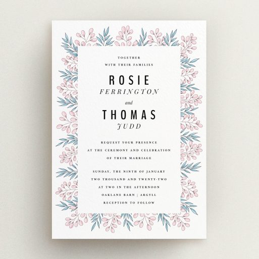 A personalised wedding invitation named "Blossom and Long Leaves". It is an A5 invite in a portrait orientation. "Blossom and Long Leaves" is available as a flat invite, with tones of blue and pink.