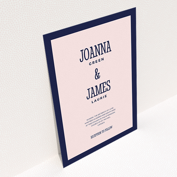 A personalised wedding invitation design titled "Bold border". It is an A5 invite in a portrait orientation. "Bold border" is available as a flat invite, with tones of navy blue and pink.