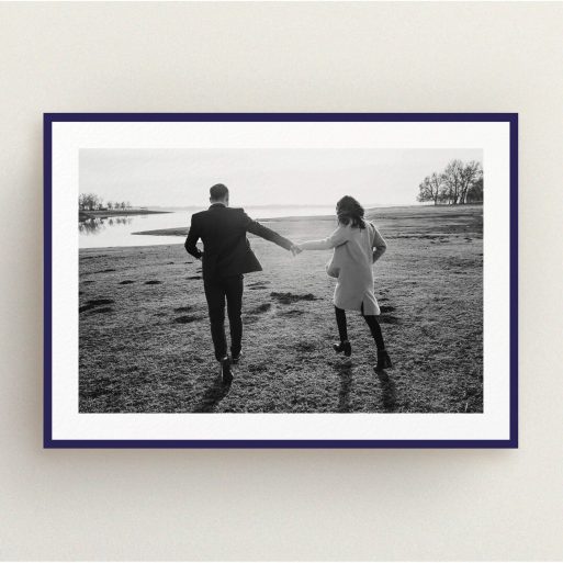 A personalised wedding invitation named "Classic Navy Photo Frame". It is an A5 invite in a landscape orientation. It is a photographic personalised wedding invitation with room for 1 photo. "Classic Navy Photo Frame" is available as a flat invite, with tones of blue and white.