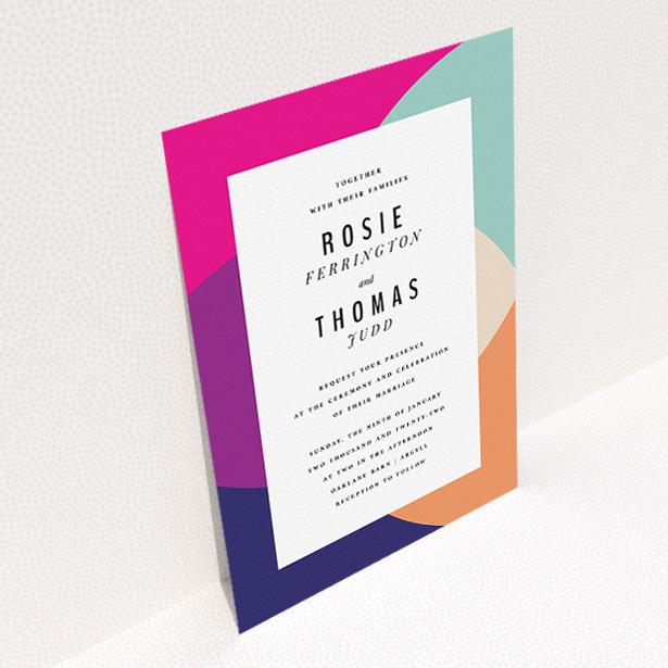 A personalised wedding invitation design titled "Concentric". It is an A5 invite in a portrait orientation. "Concentric" is available as a flat invite, with tones of white and pink.