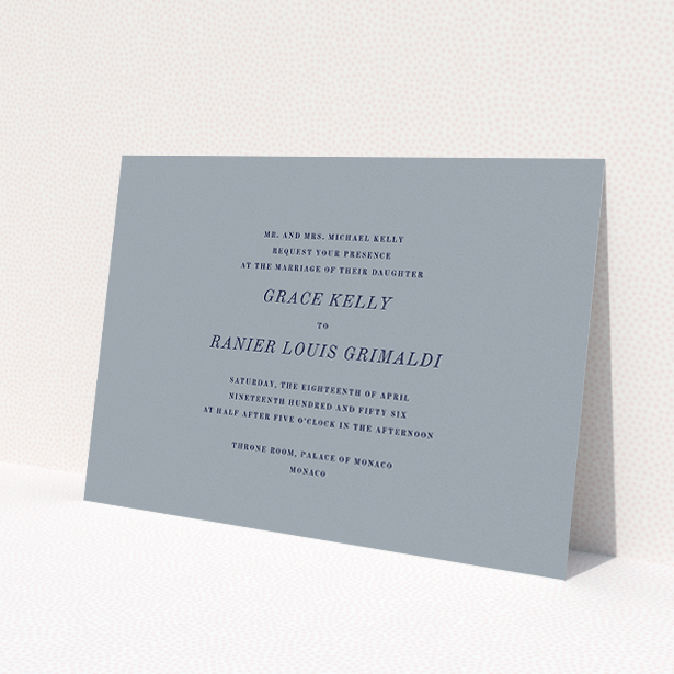A personalised wedding invitation design named "Dark and Stormy". It is an A5 invite in a landscape orientation. "Dark and Stormy" is available as a flat invite, with tones of dark grey and navy blue.