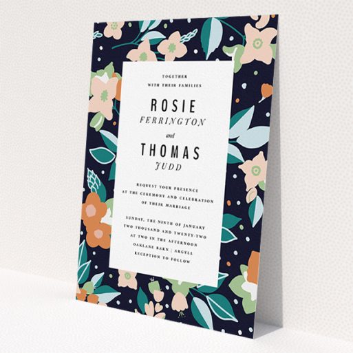 A personalised wedding invitation design named 'Dark Garden'. It is an A5 invite in a portrait orientation. 'Dark Garden' is available as a flat invite, with tones of navy blue, pink and orange.