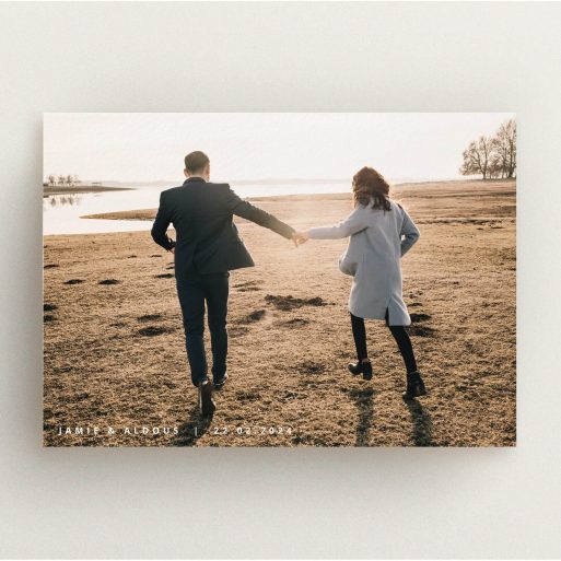 A personalised wedding invitation called "Date and Name". It is an A5 invite in a landscape orientation. It is a photographic personalised wedding invitation with room for 1 photo. "Date and Name" is available as a flat invite, with mainly white colouring.