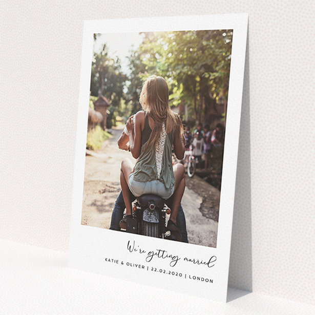 A personalised wedding invitation design named 'Hoxton Square'. It is an A5 invite in a portrait orientation. It is a photographic personalised wedding invitation with room for 1 photo. 'Hoxton Square' is available as a flat invite, with mainly white colouring.
