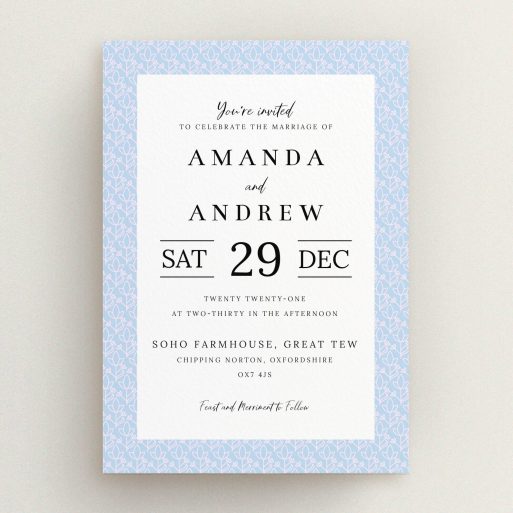 A personalised wedding invitation design called "Isometric Flowers". It is an A5 invite in a portrait orientation. "Isometric Flowers" is available as a flat invite, with tones of blue and white.