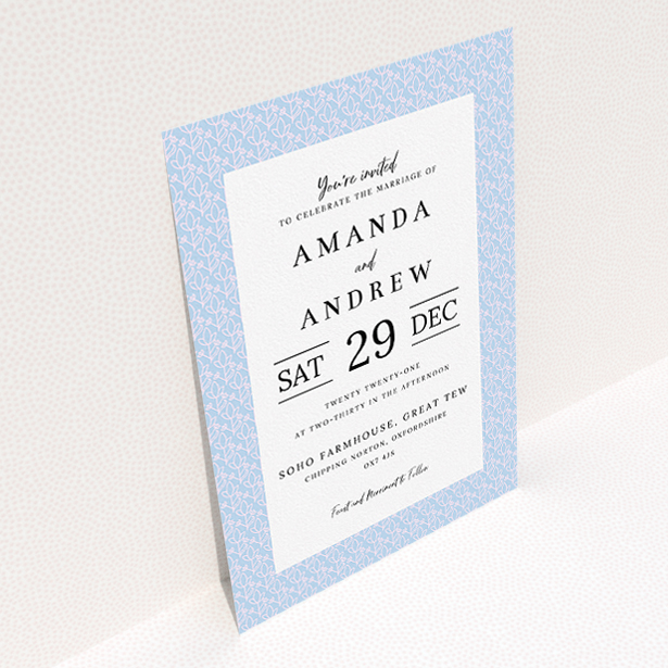 A personalised wedding invitation design called "Isometric Flowers". It is an A5 invite in a portrait orientation. "Isometric Flowers" is available as a flat invite, with tones of blue and white.