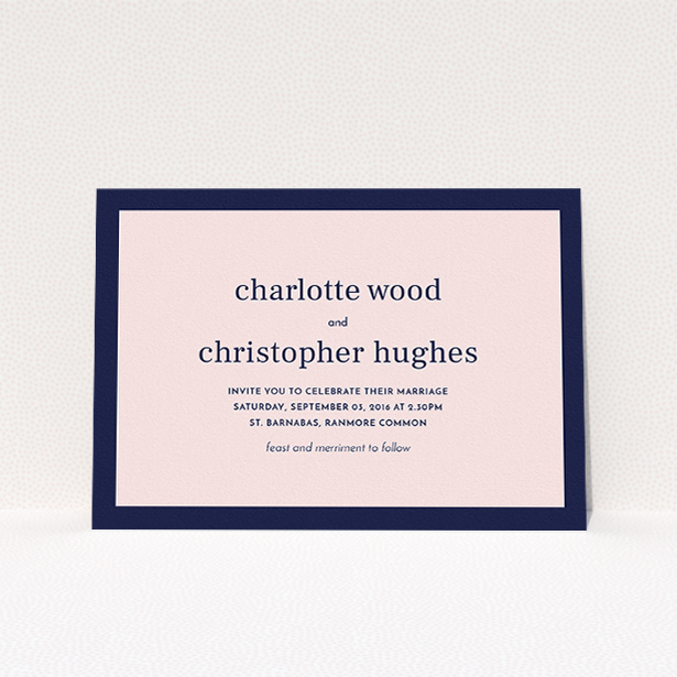 A personalised wedding invitation design titled "Laydown simple". It is an A5 invite in a landscape orientation. "Laydown simple" is available as a flat invite, with tones of navy blue and pink.