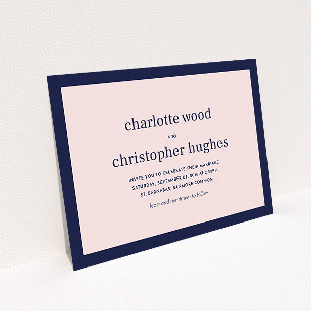 A personalised wedding invitation design titled "Laydown simple". It is an A5 invite in a landscape orientation. "Laydown simple" is available as a flat invite, with tones of navy blue and pink.