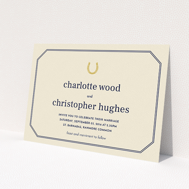 A personalised wedding invitation named "Lucky horse shoe". It is an A5 invite in a landscape orientation. "Lucky horse shoe" is available as a flat invite, with tones of cream and gold.