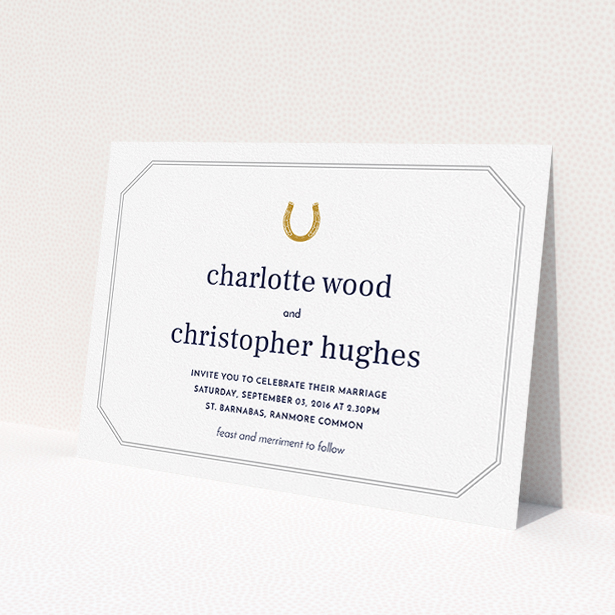 A personalised wedding invitation design called "Lucky horse shoe". It is an A5 invite in a landscape orientation. "Lucky horse shoe" is available as a flat invite, with tones of white, gold and grey.