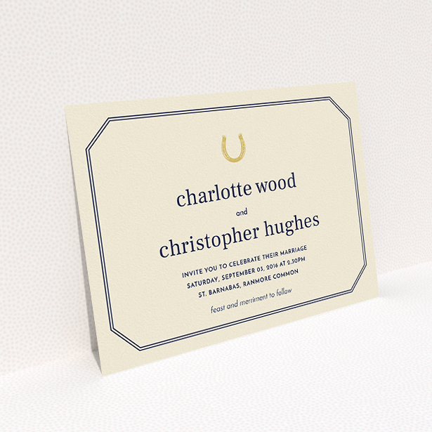 A personalised wedding invitation named "Lucky horse shoe". It is an A5 invite in a landscape orientation. "Lucky horse shoe" is available as a flat invite, with tones of cream and gold.