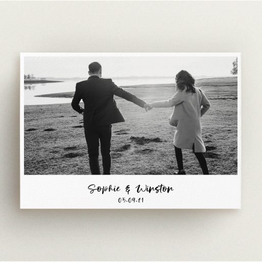 A personalised wedding invitation called "Monochrome Photo". It is an A5 invite in a landscape orientation. It is a photographic personalised wedding invitation with room for 1 photo. "Monochrome Photo" is available as a flat invite, with mainly white colouring.
