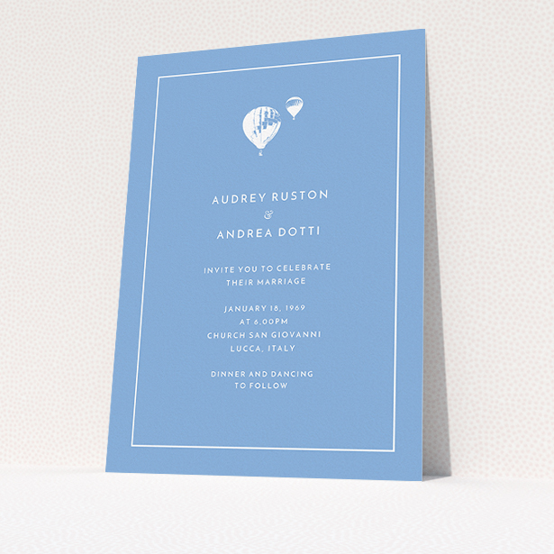A personalised wedding invitation named "Off and away". It is an A5 invite in a portrait orientation. "Off and away" is available as a flat invite, with tones of blue and white.