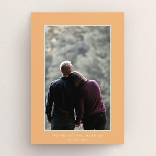 A personalised wedding invitation design titled "Orange Mint Photo Frame". It is an A5 invite in a portrait orientation. It is a photographic personalised wedding invitation with room for 1 photo. "Orange Mint Photo Frame" is available as a flat invite, with tones of orange and blue.