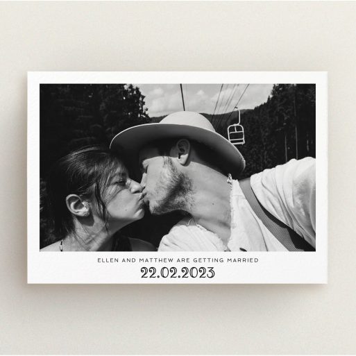 A personalised wedding invitation named "Ornate Date". It is an A5 invite in a landscape orientation. It is a photographic personalised wedding invitation with room for 1 photo. "Ornate Date" is available as a flat invite, with mainly white colouring.