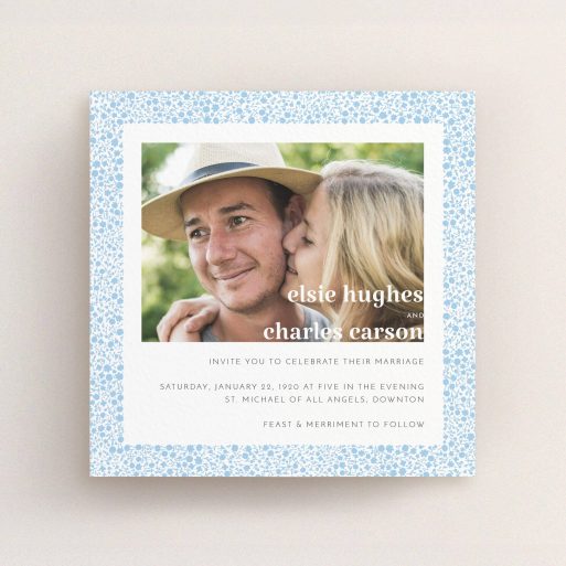 A personalised wedding invitation design called "Pastel flower border". It is a square (148mm x 148mm) invite in a square orientation. It is a photographic personalised wedding invitation with room for 1 photo. "Pastel flower border" is available as a flat invite, with tones of blue and white.