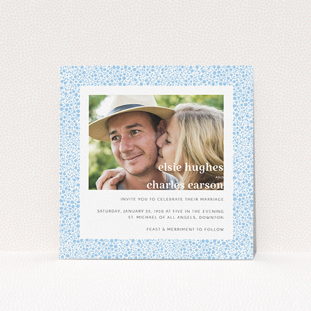 A personalised wedding invitation design called "Pastel flower border". It is a square (148mm x 148mm) invite in a square orientation. It is a photographic personalised wedding invitation with room for 1 photo. "Pastel flower border" is available as a flat invite, with tones of blue and white.
