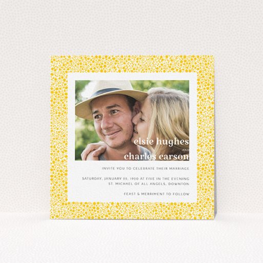 A personalised wedding invitation design titled "Pastel flower border". It is a square (148mm x 148mm) invite in a square orientation. It is a photographic personalised wedding invitation with room for 1 photo. "Pastel flower border" is available as a flat invite, with tones of yellow and white.
