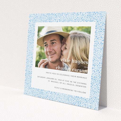 A personalised wedding invitation design called 'Pastel flower border'. It is a square (148mm x 148mm) invite in a square orientation. It is a photographic personalised wedding invitation with room for 1 photo. 'Pastel flower border' is available as a flat invite, with tones of blue and white.