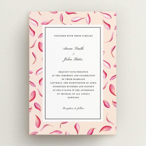 A personalised wedding invitation design called "Petal avalanche". It is an A5 invite in a portrait orientation. "Petal avalanche" is available as a flat invite, with tones of pink, red and white.