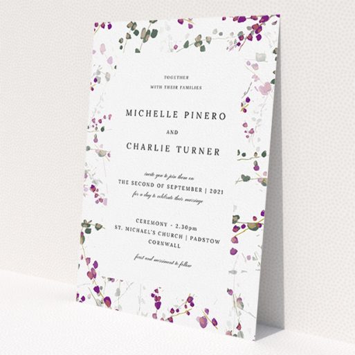 A personalised wedding invitation called 'Purple Lupine'. It is an A5 invite in a portrait orientation. 'Purple Lupine' is available as a flat invite, with tones of purple, pink and dark green.