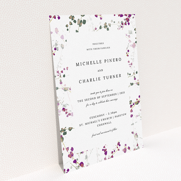 A personalised wedding invitation called "Purple Lupine". It is an A5 invite in a portrait orientation. "Purple Lupine" is available as a flat invite, with tones of purple, pink and dark green.