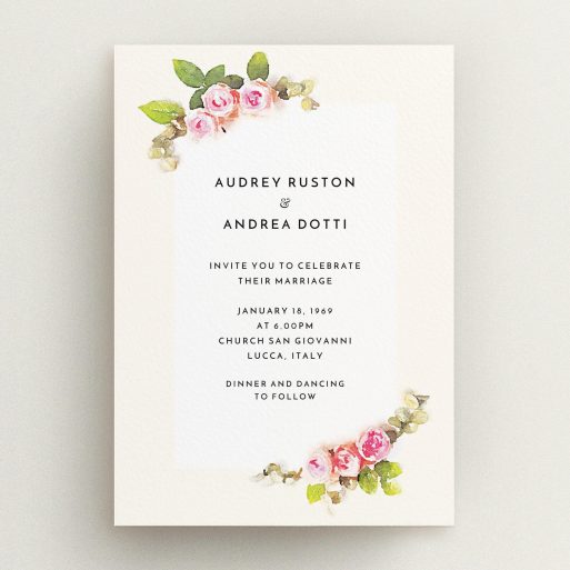 A personalised wedding invitation design titled "Roses on the corner". It is an A5 invite in a portrait orientation. "Roses on the corner" is available as a flat invite, with tones of pink, green and cream.