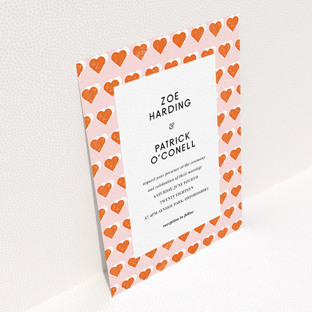 A personalised wedding invitation design called "Rustic Hearts". It is an A6 invite in a portrait orientation. "Rustic Hearts" is available as a flat invite, with tones of pink and orange.