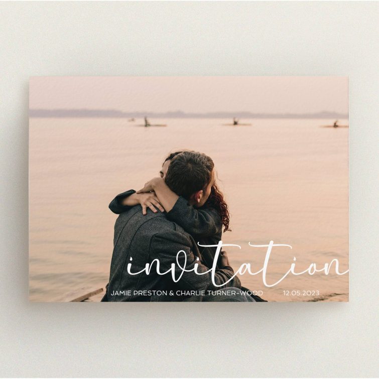 A personalised wedding invitation design titled "Salamanca". It is an A5 invite in a landscape orientation. It is a photographic personalised wedding invitation with room for 1 photo. "Salamanca" is available as a flat invite, with mainly white colouring.